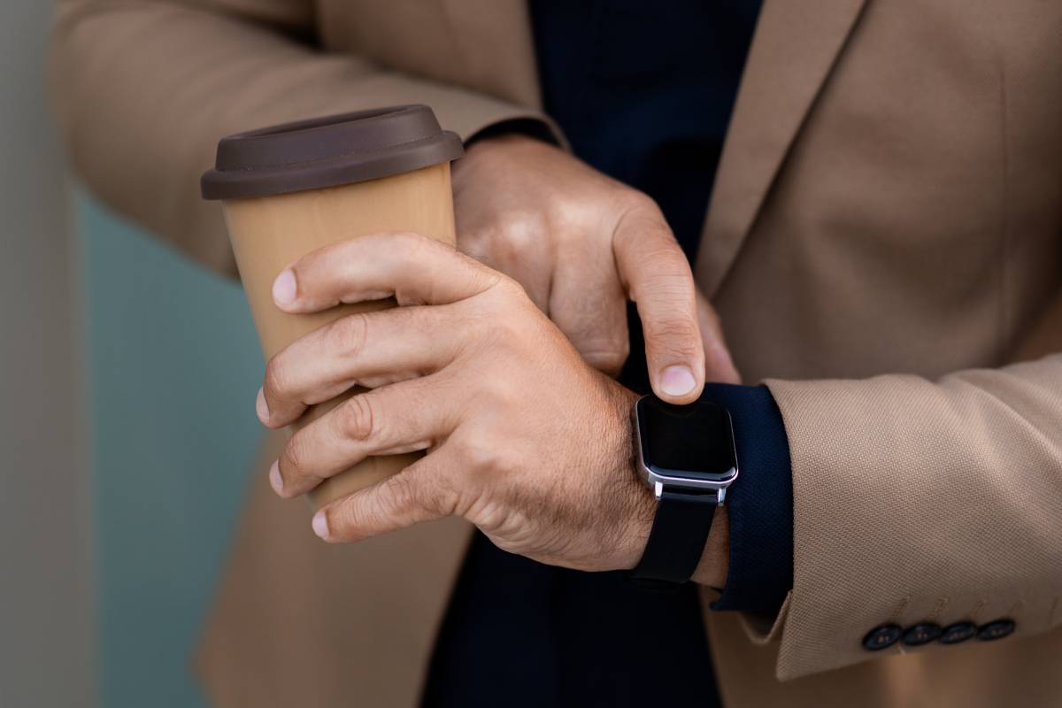 cropped-businessman-checking-smart-watch-while-dri-2023-11-27-05-14-51-utc (1)