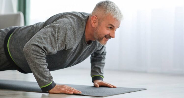 closeup-of-elder-man-exercising-at-home-2023-11-27-05-11-36-utc (1)